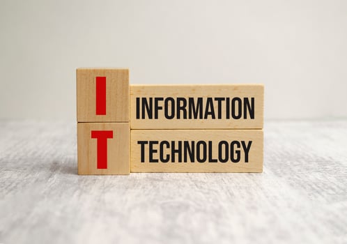 information technology words on wooden blocks and white background photo