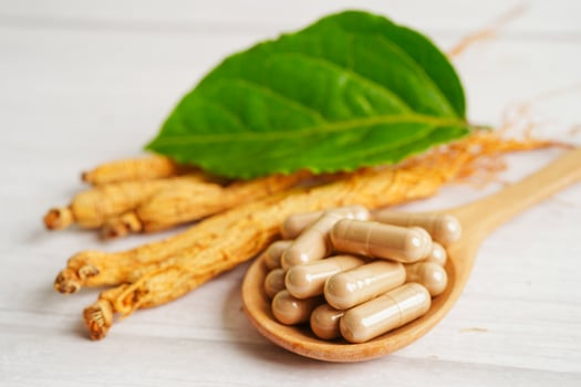 Ginseng roots and green leaf, healthy food. photo