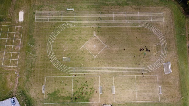 An Aerial Footage and High Angle view of Play Ground of a High School of boys at Luton Town of England, British Motorways and Highways photo
