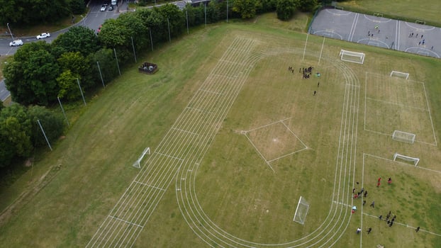 An Aerial Footage and High Angle view of Play Ground of a High School of boys at Luton Town of England, British Motorways and Highways photo