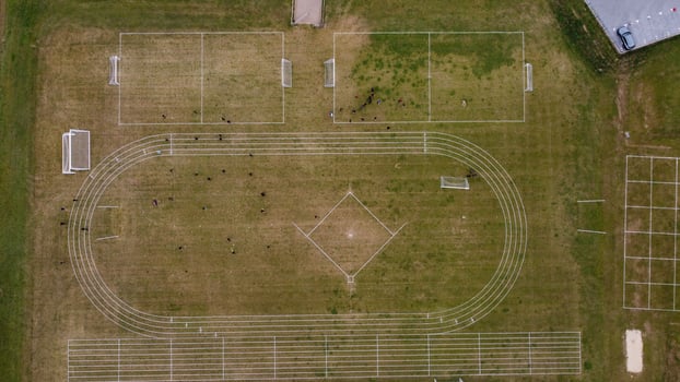 An Aerial Footage and High Angle view of Play Ground of a High School of boys at Luton Town of England, British Motorways and Highways photo