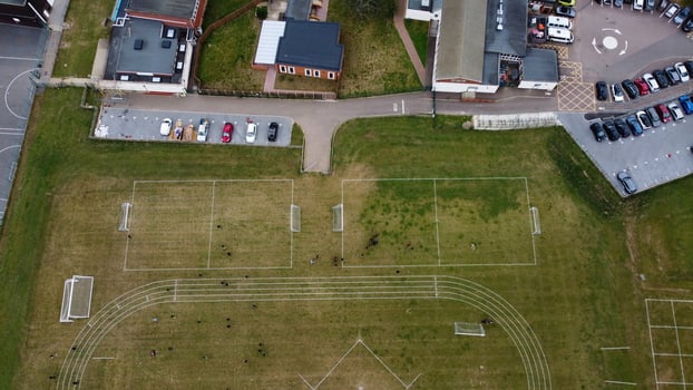 An Aerial Footage and High Angle view of Play Ground of a High School of boys at Luton Town of England, British Motorways and Highways photo
