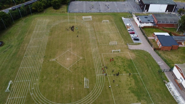 An Aerial Footage and High Angle view of Play Ground of a High School of boys at Luton Town of England, British Motorways and Highways photo