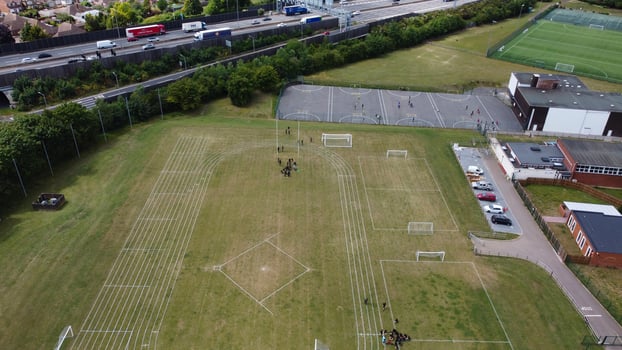 An Aerial Footage and High Angle view of Play Ground of a High School of boys at Luton Town of England, British Motorways and Highways photo