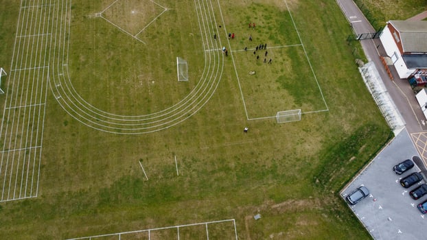 An Aerial Footage and High Angle view of Play Ground of a High School of boys at Luton Town of England, British Motorways and Highways photo
