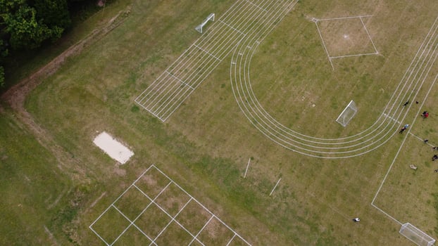 An Aerial Footage and High Angle view of Play Ground of a High School of boys at Luton Town of England, British Motorways and Highways photo