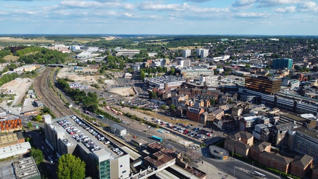 Aerial footage high angle view of Luton Town of England and Railways Station and Train on Tracks photo