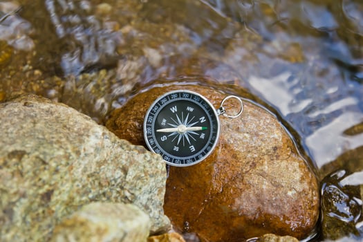 compass on the rock photo