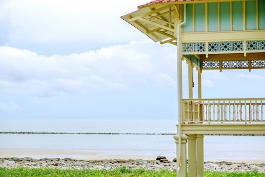 Old and vintage Thai wooden house by the sea. photo