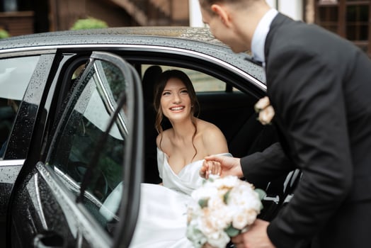 young couple bride and groom in a white short dress photo