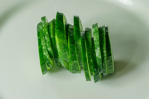 cucumbers on a white plate photo
