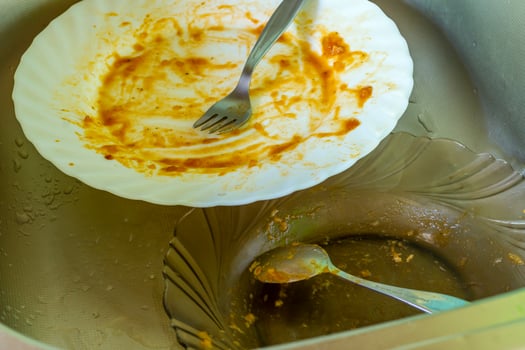 dirty dishes in metal sink photo