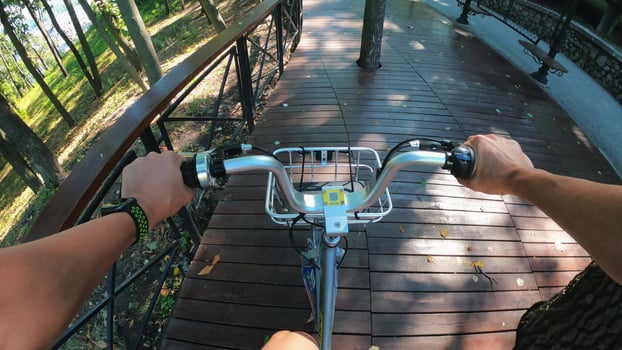 A view from the first person to the steering wheel, hands and road. photo