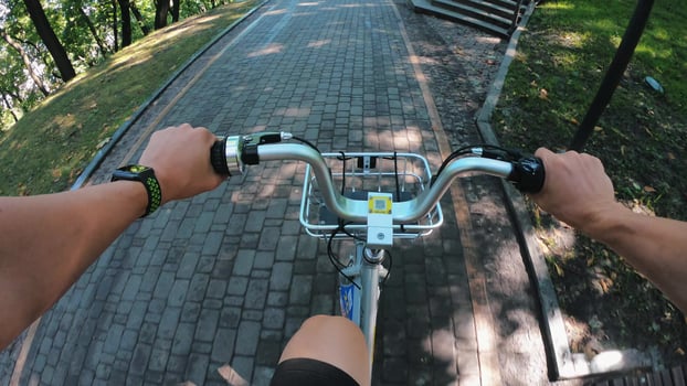 A view from the first person to the steering wheel, hands and road. photo