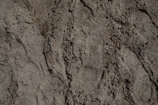 Footprints from shoes after walking on the ground photo