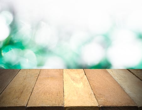 Empty wooden table in front of bokeh lights background. photo