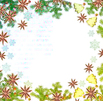 Christmas composition. Green spruce decorated with berries of mountain ash and cookies photo