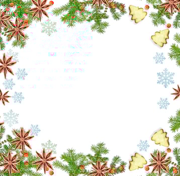 Christmas composition. Green spruce decorated with berries of mountain ash and cookies photo