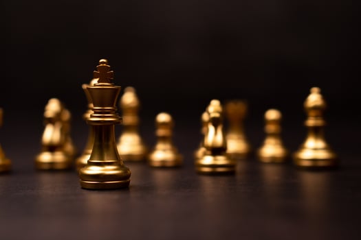 Golden Chess King standing to Be around of other chess, Concept of a leader must have courage and challenge in the competition, leadership and business vision for a win in business games photo