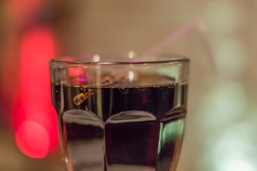 closeup of coke in a transparent glass photo