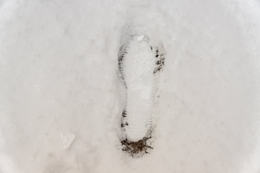 footprint on snow background photo