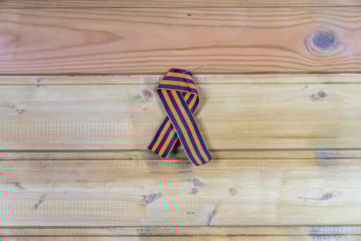 St. George Ribbon pinned to wooden wall photo