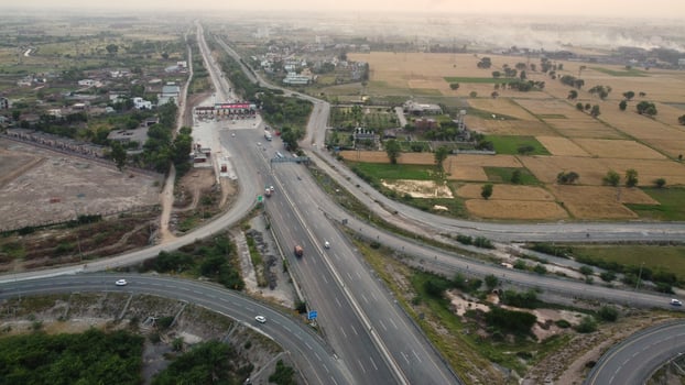 High Angle Footage and Aerial View of Pakistani Motorways M2 at Kala Shah Kaku Interchange to GT road Lahore, The Industrial Village of Punjab photo
