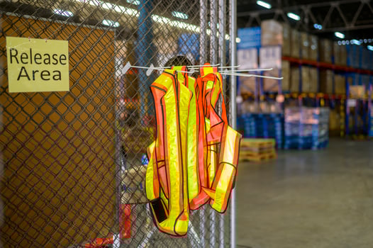 reflective jackets in modern warehouse storage of retail shop. photo