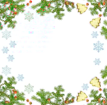 Christmas composition. Green spruce decorated with berries of mountain ash and cookies photo