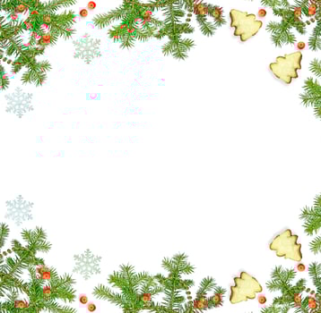 Christmas composition. Green spruce decorated with berries of mountain ash and cookies photo