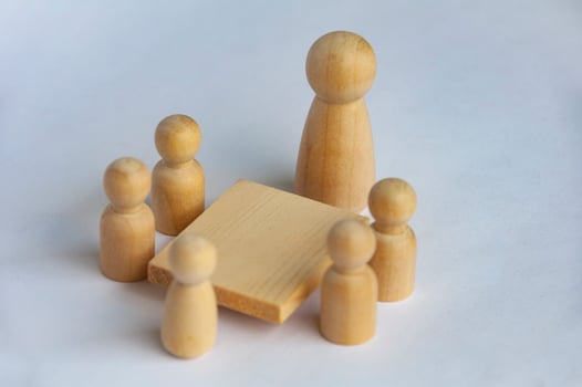 Wooden people figures having business meeting with customizable for text or ideas. photo