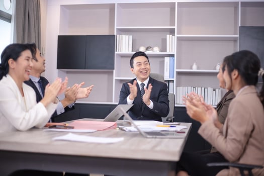 Business people meeting and discussing documents and ideas at meeting around table. photo