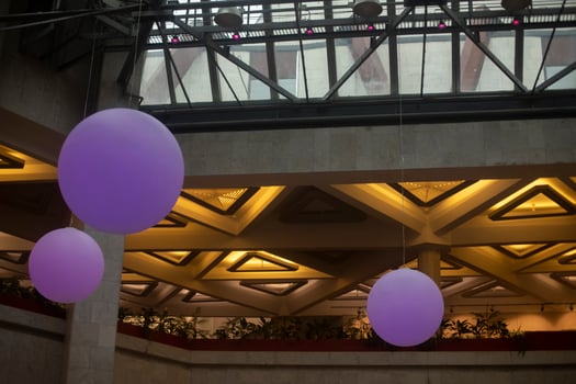 Interior of Palace of Culture. Balls hang from ceiling. Architecture details. Modern design. photo