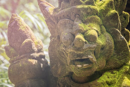 The rock giant statue in traditional Balinese style, popular decorative in many temple in Hindu religion of Bali, Indonesia. photo