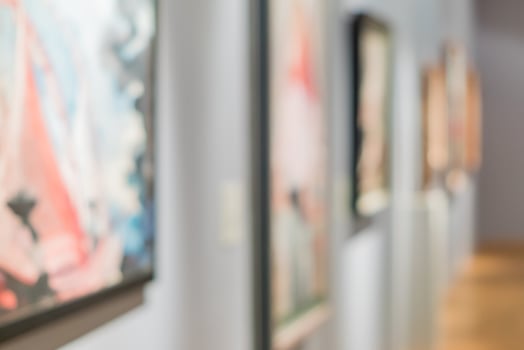 blurred paintings on the wall in museum photo