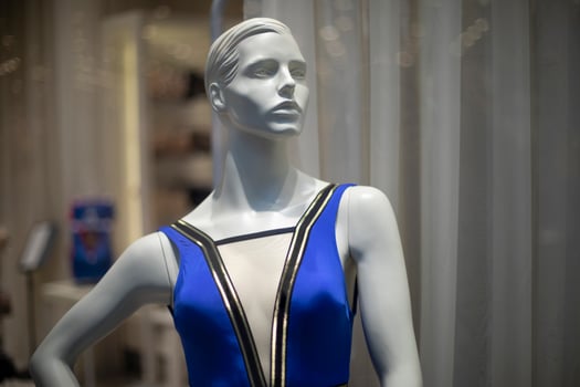 Women's mannequin in clothing store. Plastic figure of woman. Store details. Demonstration of clothes. photo