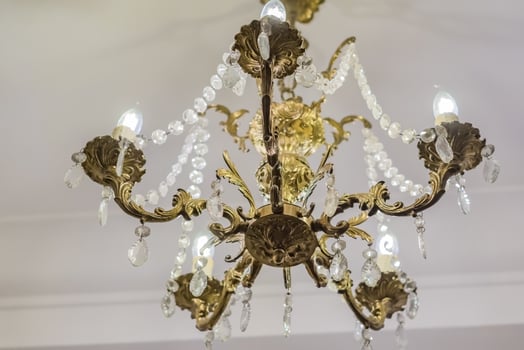 retro styled chandelier on ceiling, closeup. photo