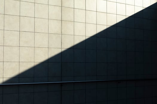 Shadow on wall. Oblique shadow on building. Details of architecture on sunny day. photo