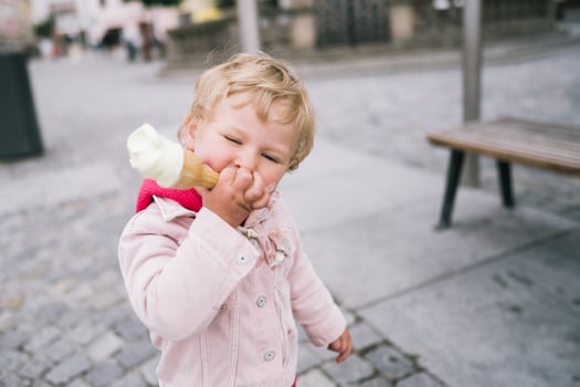 Little girl eating ice cream photo