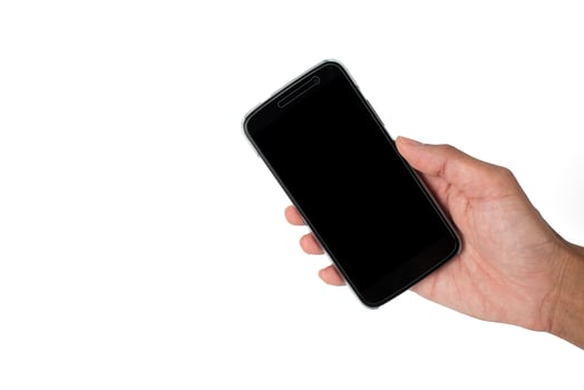 Isolated hand holding smartphone on white background photo