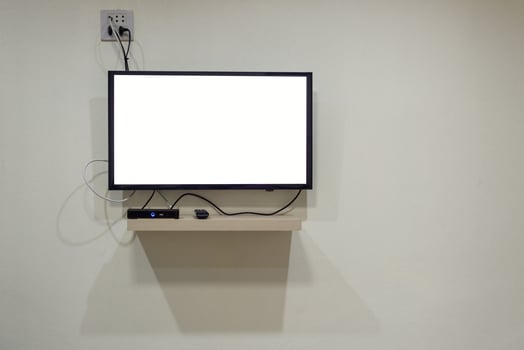 Blank TV display on the wall and cable connection photo