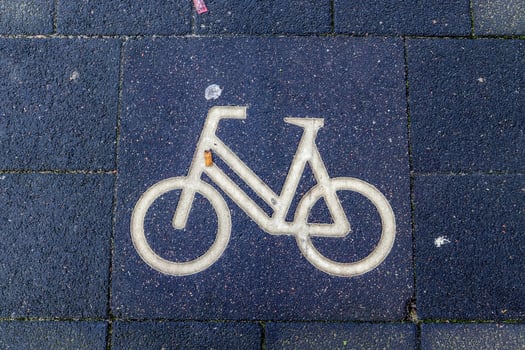 Painted bicycle signs on asphalt found in the city streets of Germany. photo