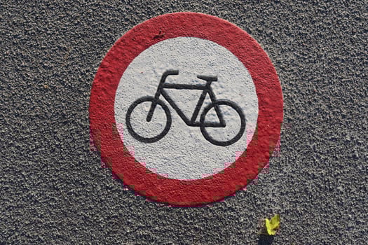 Painted bicycle signs on asphalt found in the city streets of Germany. photo