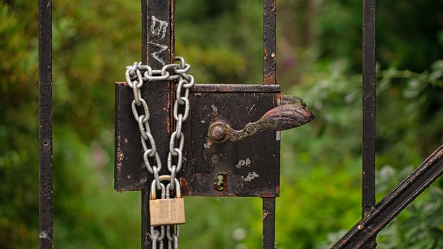 double holds better. Padlock that secures a locked door. photo