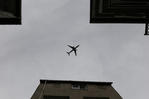 Airplane passing over Fener District in Istanbul, Turkey photo