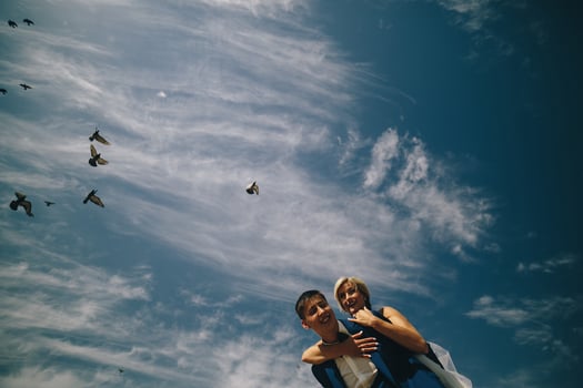 bride and groom  on the background of sky photo