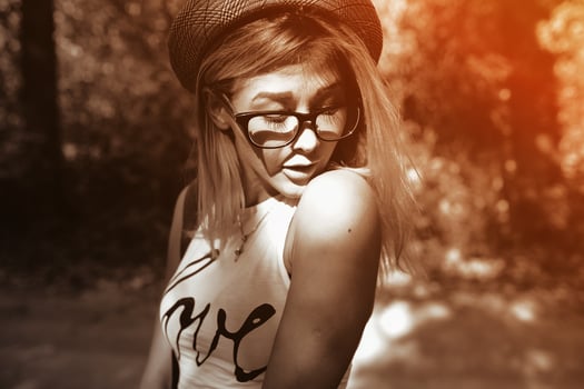 beautiful girl walking down a forest road photo