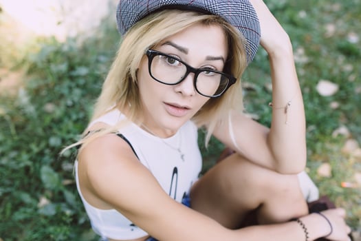 pretty girl sitting and looking at the camera photo