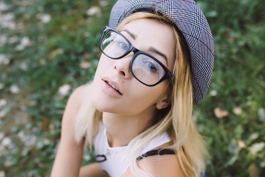 pretty girl sitting and looking at the camera photo