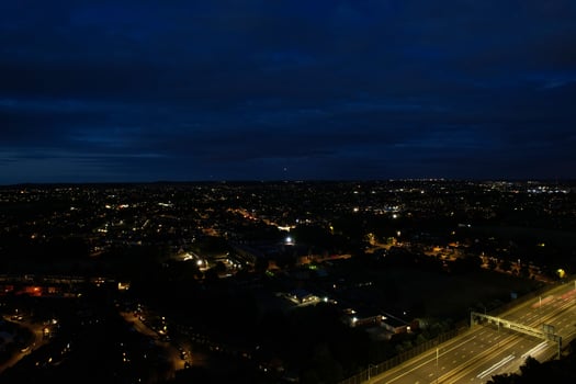 Beautiful Aerial High Angle View of British Motorways and Traffic at Luton Town of England UK at Night after Sunset photo